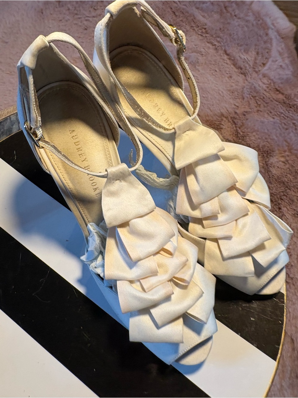 Audrey Brooke Estella Pump
With ruffles galore, this striking white pair of peep - Picture 3 of 8